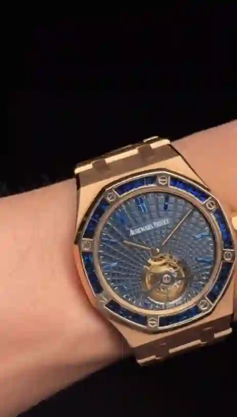 Audemars Piguet Royal Oak Tourbillon Extra-Thin in rose gold with a blue sapphire-set bezel and a blue "Evolutive